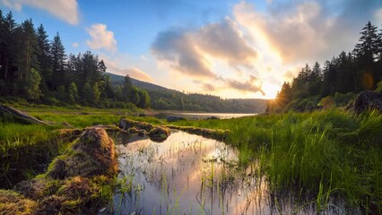 Wall Mural - gorgeous morning at the lake, time lapse of beautiful sunrise and colorful moving clouds reflected i