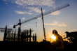 © เลิศลักษณ์ ทิพชัย - Construction engineers or managers and construction workers on a construction site Project work plan for designing houses and industrial buildings