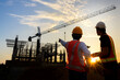 © เลิศลักษณ์ ทิพชัย - Construction engineer talks to the architect on the construction site. To describe home design work
