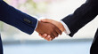 © Kirsten D/peopleimages.com - Welcome aboard partner. Shot of two unrecognisable businessmen shaking hands in a modern office.
