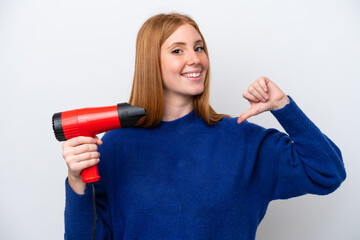 Wall Mural - Young redhead woman holding a hairdryer isolated on white background proud and self-satisfied