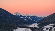 Sunrise Over Snow Capped Mountain Peaks Of Karawanks In Carinthia, Austria. Julian Alps. Scenic View On Winter Wonderland At Dawn In The Austrian Alps, Europe. Ski Tour, Snow Shoe Hiking. Hochobir