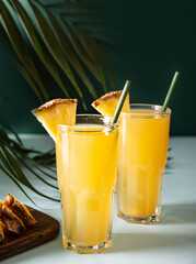 Summer refreshing tropical drink juice or cocktail with pineapple juice and tequila.