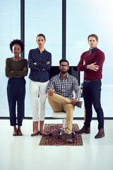 Wall Mural - success is theirs for the taking. portrait of a group young designers at a work station in front of 