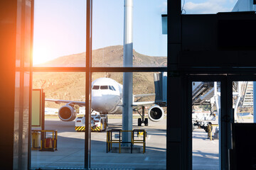 Canvas Print - Looking at the airplane through airport lounge window