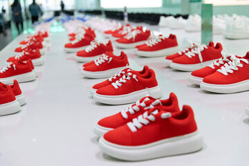 Group of children sports shoes in the store