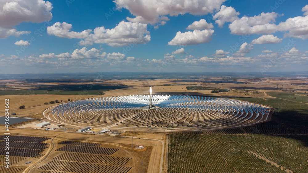 Aerial drone view of Gemasolar Thermosolar Plant in Seville, Spain. Solar energy. Green energy. Alternatives to fossil fuel. Environmentally friendly. Concentrated solar power plant. Renewable energy.