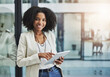 © Delmaine Donson/peopleimages.com - Make it your business to be tech savvy and industrious. Portrait of a young businesswoman smiling and holding a digital tablet in her office.