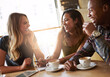 © Delmaine Donson/peopleimages.com - They always make each other laugh. Shot of a group of friends catching up over coffee in a coffee shop.