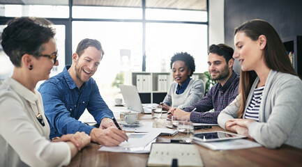 Poster - Putting their planning skills to work. Cropped shot of a group of businesspeople meeting in the boardroom.