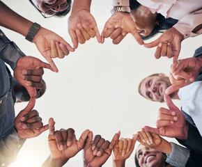 Poster - Theyre in the creative circle. Low angle shot of a team of creative colleagues making a circle with their hands in the office.