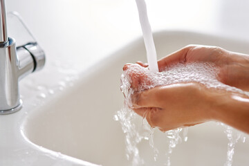 Aufkleber - Stay healthy by washing your hands. Cropped shot of hands being washed at a tap.