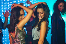Shimmy And Shake. Shot Of A Group Of Young People Having Fun On The Dancefloor In A Nightclub.
