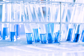 Wall Mural - glass flask in chemical science education laboratory with molecular structure in blue background