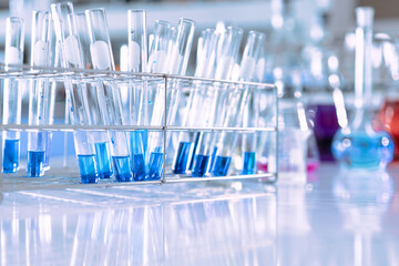 Wall Mural - glass flask in chemical science education laboratory with molecular structure in blue background