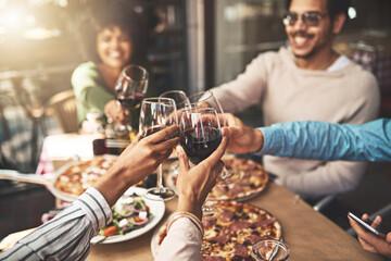 Poster - Thank you all for coming. Shot of a group of cheerful young friends having a celebratory toast with wine at dinner inside of a restaurant.