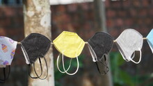 Colorful Face Masks Put On A Rope For Drying After Wash