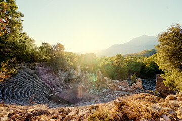 Wall Mural - Antique amphitheatre in ancient town Phaselis in Antalya region, Turkey.