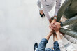 © Matthew Cerff/peopleimages.com - Youve got to get up every morning with determination. Shot of a group of unrecognizable businesspeople stacking their hands at work.
