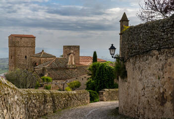 Sticker - narrow cobblestone street leads through the historic and picturesque Old Town of Trujillo