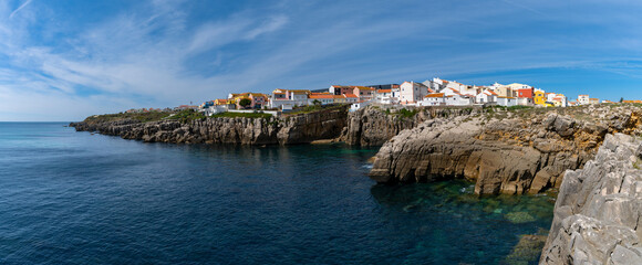 Sticker - panorama view of the jagged rocky coast and colorful houses in the center of Peniche