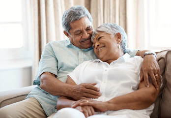 Wall Mural - I find comfort in your arms. Shot of a senior couple spending time together at home.