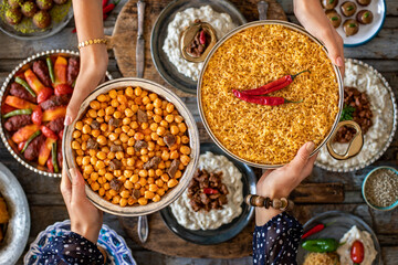 Many kinds of food at the hands of family members