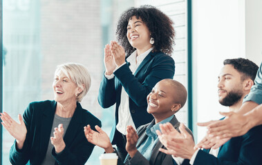 Wall Mural - well done. shot of a diverse group of businesspeople celebrating a success during a meeting in the o