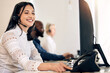 © Daiyaan Philander/peopleimages.com - Ill call the customer right away to deliver the good news. Shot of a young call centre agent using a telephone while working on a computer in an office.
