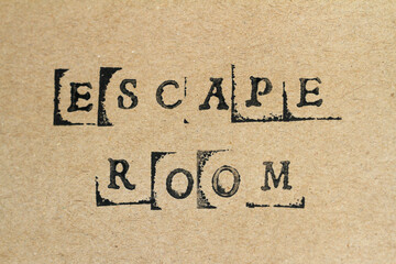 Word escape room made with letter stamps on grey hand made paper
