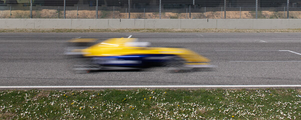 Race car speed blurred motion on asphalt racetrack competition concept