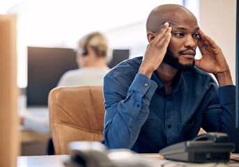 Canvas Print - Sales can be a stressful too. Shot of a young call centre agent looking stressed out while working on a computer in an office.