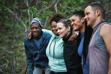 Canvas Print - Its great coming together because we motivate each other. Cropped shot of a sporty young group of friends working out in the forest.