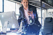 © VideoFlow - Businessman in suit using smart phone to check new candidates for international business consulting. HR, social media icons over modern panoramic office background.