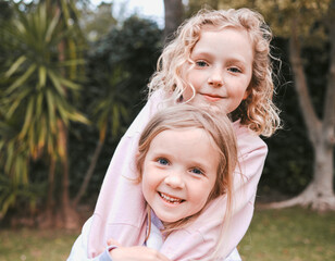 Wall Mural - Sister love is a gift from above. Shot of two adorable little girls having fun in a garden.