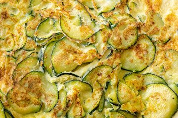 Wall Mural - Closeup of a zucchini omelette with semolina and cream