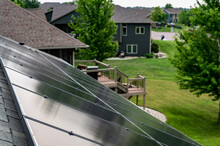 Selective Focus On Solar Panels Installed On A Residential Asphalt Shingle Roof