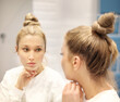 © lado2016 - Woman looking in the mirror Applying the cream..Magic anti-aging cream.