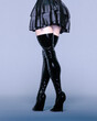 © vladnikon - Beautiful female leg puffy short skirt and high boots.