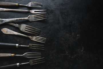 Wall Mural - Vintage rustic cutlery on dark