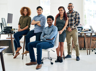 Poster - The best team for your brand. Portrait of a team of happy and confident colleagues working in a modern office.