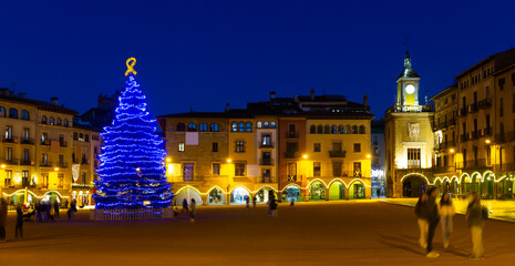 Wall Mural - Illuminated streets of old town of Spanish Vic city festively decorated for Christmas