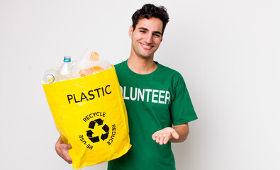 Sticker - handsome hispanic man smiling happily with friendly and  offering and showing a concept. ecology concept