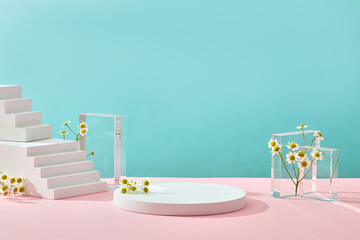 A front view of white and transparent podium decorated with flower and blue background with blank space for advertising 