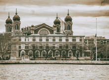 Ellis Island Building Exterior, View From Moving Boat In New Yor