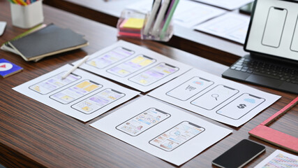 Wall Mural - creative designer workplace with digital tablet and wireframe sketches for mobile application on woo