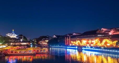 Fototapete - time lapse of the Nanjing confucius temple and Qinhuai river at night, China