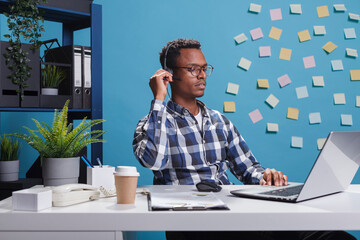Wall Mural - customer care consultant operator on phone call with client requesting help regarding application do