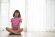 © waranyu - Asian girl meditating, lovely kid