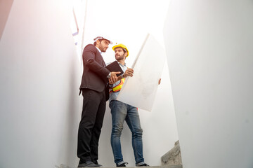 Fototapete - Architects and engineer discussing project of building outdoors,New house builder.